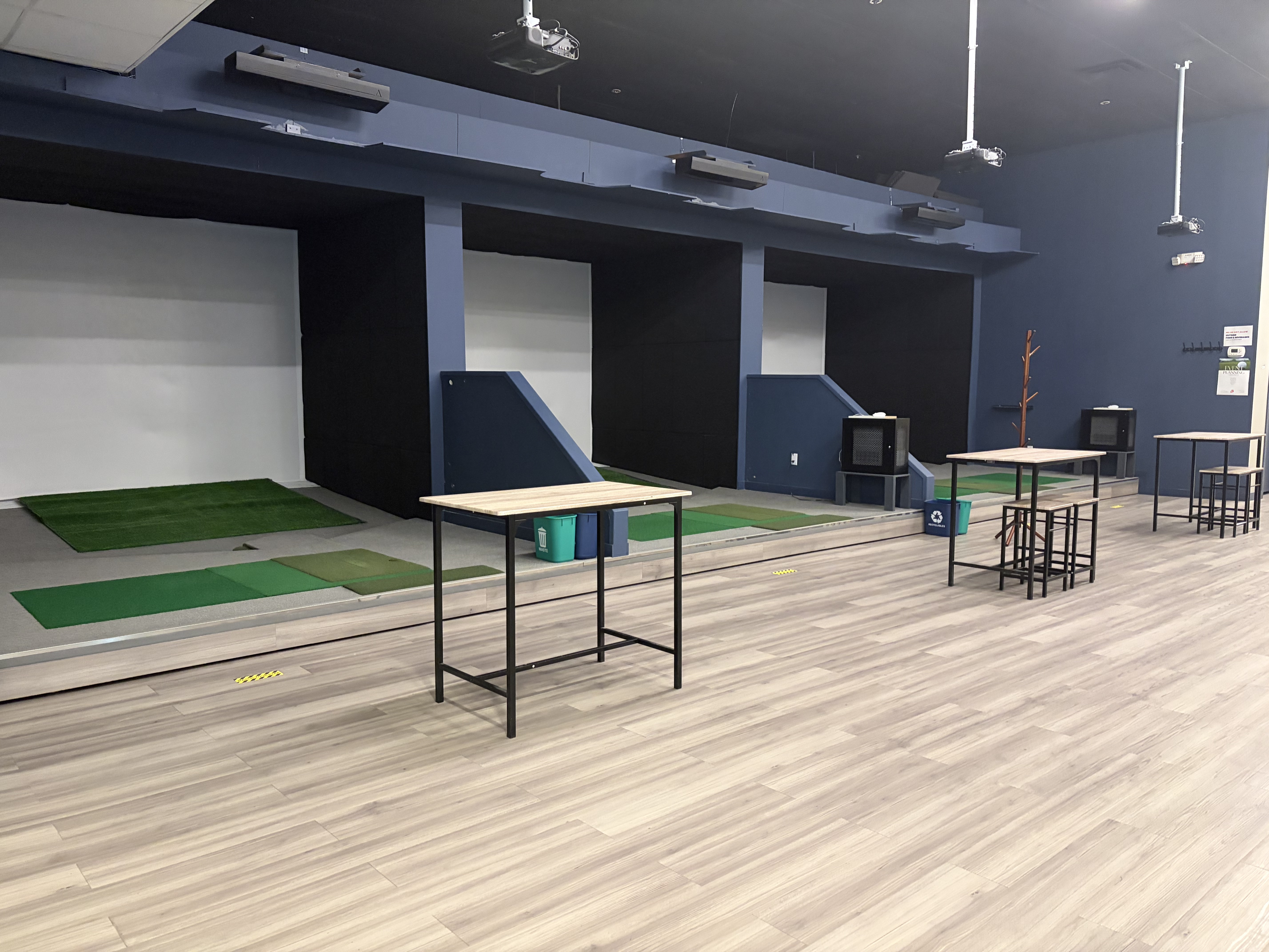 The open simulator bays at Ballistic Indoor Golf